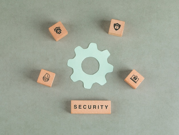 Conceptual of security with wooden blocks, paper settings icon. Free Photo